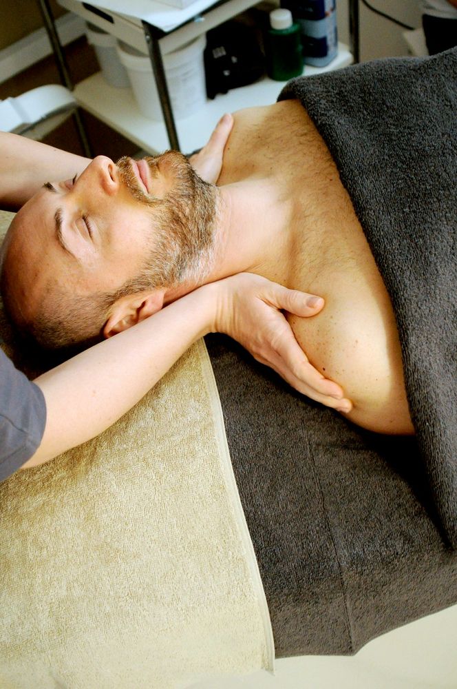 Deep tissue massage focused on the shoulders and back